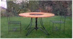 FOR SALE! - Dining table available with 4 chairs and a wooden top with a glass centre piece
